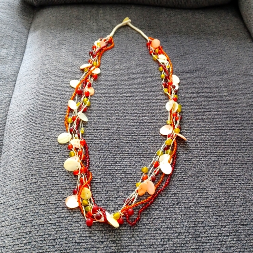 4/$16** Beautiful green, orange, and red necklace with faux shells throughout.